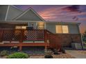 A welcoming front porch invites you into this lovely townhome, adorned with plants and flowers at 4220 E 119Th Pl # A, Thornton, CO 80233