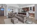 Comfortable living room area open to the kitchen featuring ample seating and natural light at 7600 Patrick Trl, Elizabeth, CO 80107