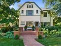 Beautiful home featuring detailed trim, brick steps, and professional landscaping at 141 N Gilpin St, Denver, CO 80218
