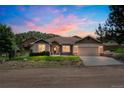 Inviting single-Gathering home with beautiful landscaping, stone accents and a two-car garage at 119 Lake Ave, Palmer Lake, CO 80133