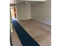 Bright living room featuring neutral paint, carpet, and a sliding door at 1731 Quail St, Lakewood, CO 80215