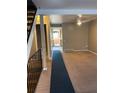 Living room with neutral-colored carpeting and a ceiling fan at 1731 Quail St, Lakewood, CO 80215