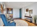 Cozy living room featuring hardwood floors, comfortable seating, and ample natural light at 1201 N Williams St # 4C, Denver, CO 80218