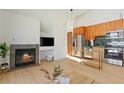 Open-concept space with a fireplace and a kitchen in the background at 34 Highfield Trl # 307, Breckenridge, CO 80424