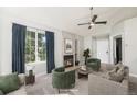 Staged living room features a gas fireplace, large picture window, and modern decor at 4076 S Carson St # H, Aurora, CO 80014