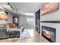 Inviting living room featuring a cozy fireplace and modern furniture at 2541 S Bahama Cir # E, Aurora, CO 80013