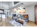 Bright living room with a large comfortable couch, stylish decor, and great natural light at 2541 S Bahama Cir # E, Aurora, CO 80013