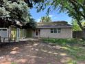 Single-story home featuring brick accents and well-maintained landscaping at 5063 W Radcliff Ave, Denver, CO 80236