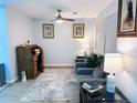 Bright room showing a vintage roll top desk and comfortable seating near natural light at 12223 E Ford E Ave # 12223, Aurora, CO 80012