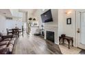 Inviting living room with wood floors, fireplace, and open concept design at 2541 S Bahama Cir # F, Aurora, CO 80013