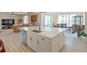 Open-concept kitchen with large island, stainless steel appliances, and modern finishes at 188 S Waterloo St, Aurora, CO 80018