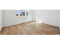 Light-filled bedroom with sleek, modern flooring and ample natural light at 24739 E 39Th Ave, Aurora, CO 80019