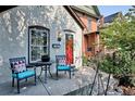 Inviting front porch with a sitting area, perfect for relaxing outdoors at 2731 W 32Nd Ave, Denver, CO 80211