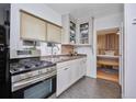 Efficient kitchen with stainless steel appliances and natural light at 2731 W 32Nd Ave, Denver, CO 80211