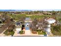 Aerial view of home nestled in neighborhood near a park, offering a serene environment with mountain views at 11525 Eaton Ct, Westminster, CO 80020