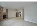 Open concept kitchen with stainless steel appliances and white cabinets at 4134 S Fraser Way # E, Aurora, CO 80014
