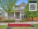 Charming two-story brick home with a covered front porch, well-maintained landscaping, and mature trees in a suburban neighborhood at 5535 W 96Th Pl, Westminster, CO 80020