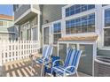 Inviting outdoor patio with chairs and privacy fence, perfect for relaxing or entertaining guests at 8199 Welby Rd # 3102, Denver, CO 80229