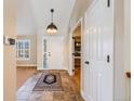 Spacious entryway with tile flooring and access to office at 10976 W 55Th Ln, Arvada, CO 80002