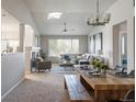 Open floor plan with dining area, large windows, and comfortable living space at 20550 E Lake Cir, Centennial, CO 80016
