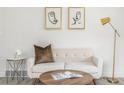 Close-up of a stylish living room arrangement with sofa, pillows, artwork, and modern lamp at 3311 Jasmine St, Denver, CO 80207