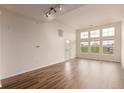 Spacious living room features hardwood floors, light walls, and lots of natural light at 9633 E 5Th Ave # 10304, Denver, CO 80230