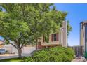 Two-story home featuring neutral siding, red shutters, large tree, and a two-car garage at 11200 W 102Nd Ave, Broomfield, CO 80021