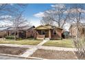 Quaint brick home on tree-lined street with a sidewalk; cozy, well-maintained property at 2039 S Sherman St, Denver, CO 80210