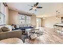 Inviting living room showcasing a ceiling fan and tile floors, perfect for relaxing and entertaining at 9023 Apache Plume Dr # D, Parker, CO 80134