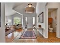 Bright foyer featuring tile flooring, high ceilings and a gorgeous window overlooking the front yard at 10653 W Parkhill Dr, Littleton, CO 80127