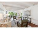 Bright living room featuring exposed beam ceiling, hardwood floors and comfortable seating at 4801 E 9Th Ave # 402S, Denver, CO 80220