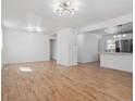 Bright and spacious living room featuring hardwood floors and modern lighting at 3110 W 66Th Ave, Denver, CO 80221