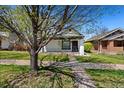 Charming single-story home with a quaint front porch, landscaped garden, and inviting curb appeal at 3147 W 39Th Ave, Denver, CO 80211