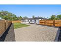 This oversized lot backyard is enclosed with new fencing and rocks, and has newly installed turf at 3216 Elizabeth, Denver, CO 80205