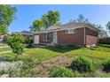 Attractive brick home with well-kept landscaping and an attached one-car garage at 11320 Irma Dr, Northglenn, CO 80233