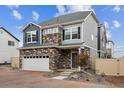 Charming two-story home showcasing stone accents and neutral siding at 4028 N Rome St, Aurora, CO 80019