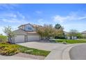 Beautiful exterior featuring a spacious driveway and manicured front yard at 7226 Dove Ct, Parker, CO 80134