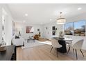Inviting living area with hardwood floors, contemporary furnishings, and plenty of natural light at 3070 N Glencoe St, Denver, CO 80207