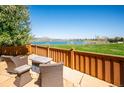 Breathtaking lake view from this patio with stone pavers and seating at 12421 W Fair Dr, Littleton, CO 80127