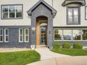 Inviting front entrance with a modern design and well-manicured landscaping at 22 Rangeview Dr, Wheat Ridge, CO 80215