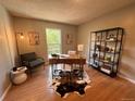 Well-lit office space with a large window and hardwood floors at 3550 S Harlan St # 259, Denver, CO 80235