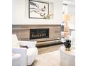 Elegant fireplace with decorative tile surround and modern design elements at 2659 S Cherokee St, Denver, CO 80223