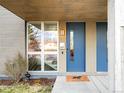 Stylish blue front door with modern accents and a welcoming entrance with a window feature at 2659 S Cherokee St, Denver, CO 80223