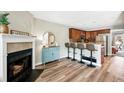Bright living space with a cozy fireplace, stylish decor, and kitchen breakfast bar at 1172 S Zeno Way # F, Aurora, CO 80017
