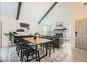 Open-concept living space featuring vaulted ceilings, modern decor, and abundant natural light at 1696 Geneva Cir, Longmont, CO 80503