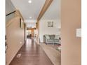 View of front entry, hardwood floors, and an open view of the living room, dining area, and stairs at 5251 Truckee St, Denver, CO 80249