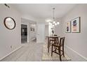 Bright dining room with a round table, stylish chairs, and modern artwork at 7481 Singing Hills Dr, Boulder, CO 80301