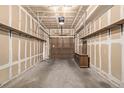 Spacious garage with shelving and a dresser, offering ample storage and organizational options at 7481 Singing Hills Dr, Boulder, CO 80301