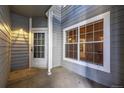 Outdoor patio with white door and large window allows plenty of natural light at 7481 Singing Hills Dr, Boulder, CO 80301