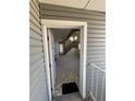 Condo entryway featuring neutral walls and floors with a staircase leading upstairs at 942 S Walden St # 206, Aurora, CO 80017